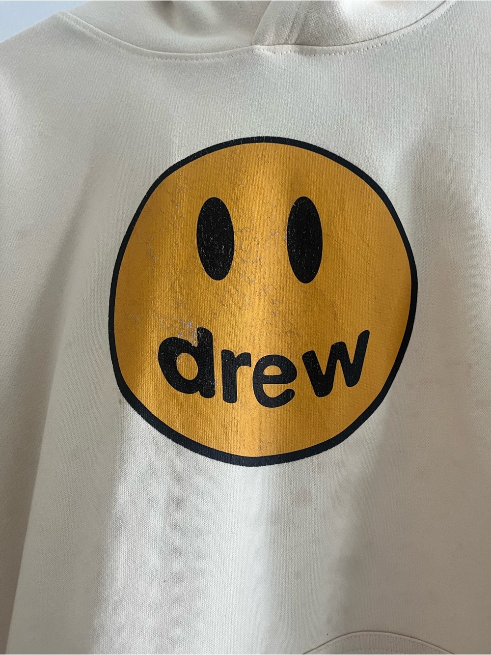 DREW Cream Hoodie with Yellow Smiley Logo and Black Accents